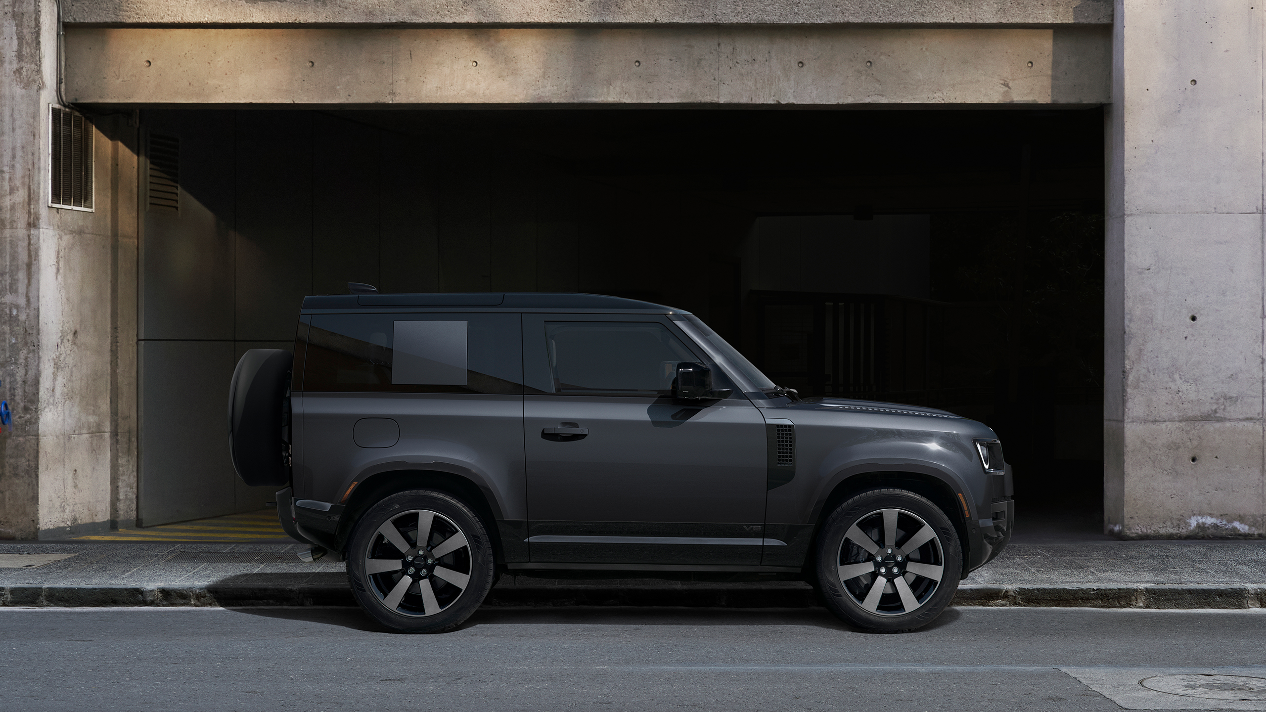 Defender side view parked on Road