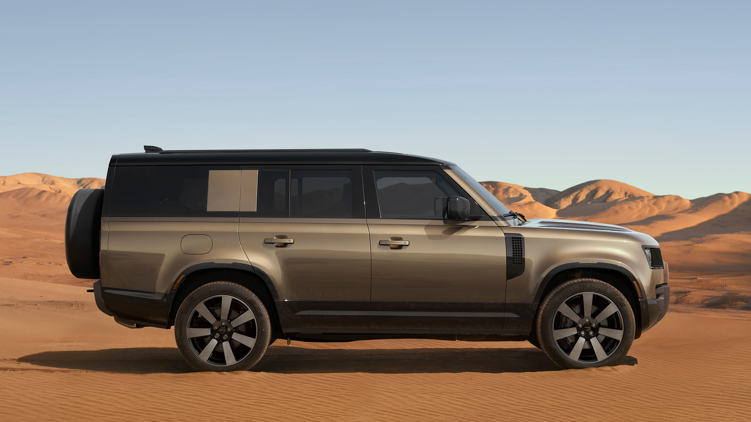 Defender driving in the desert